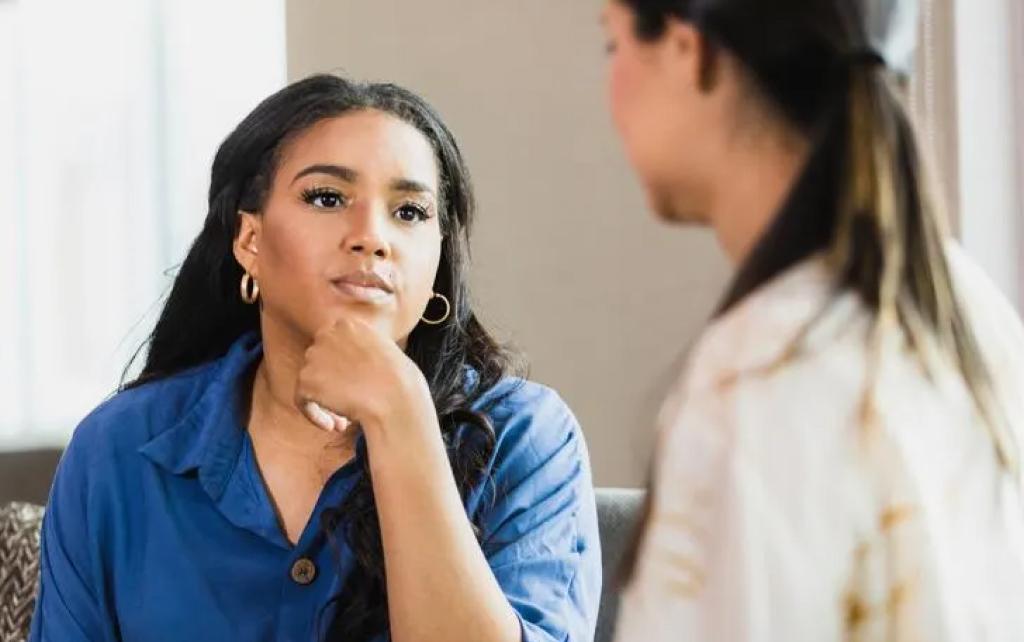 Counselor listening to a patient